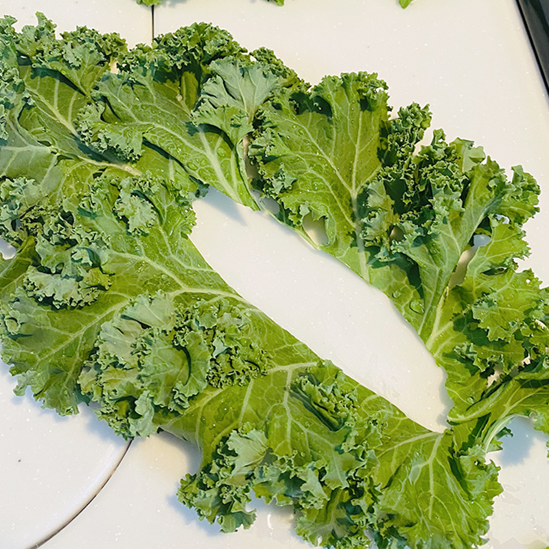Wash kale, dry and remove rib from each leaf.