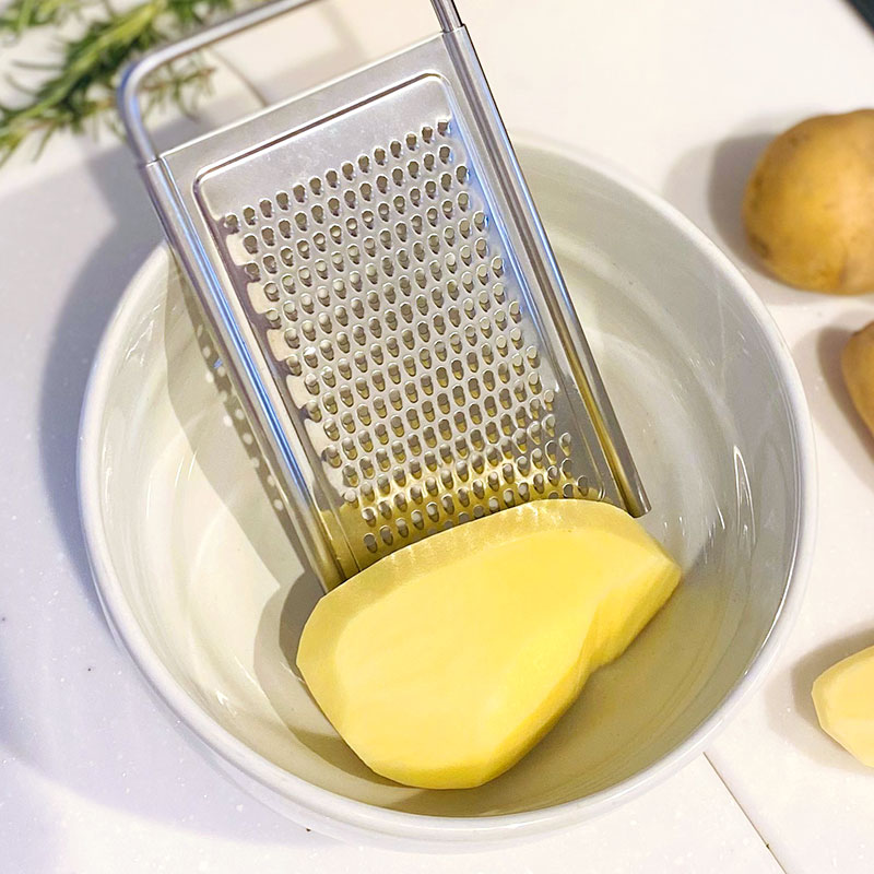 Peel and finely grate potatoes into a large bowl.