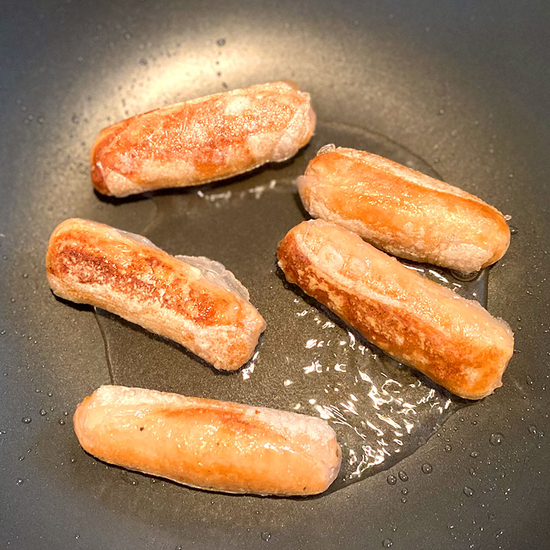 Fry the SoMeat sausages over a medium heat for about 6 min, until brown.