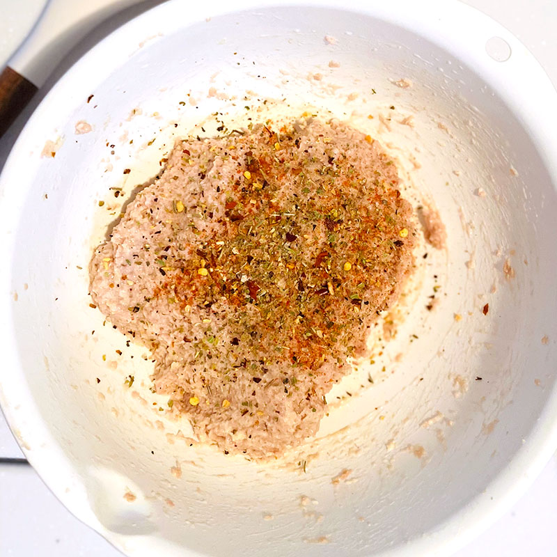In a mixing bowl, mix the SoMeat and the soaked bread. Season with paprika, oregano, salt and pepper.