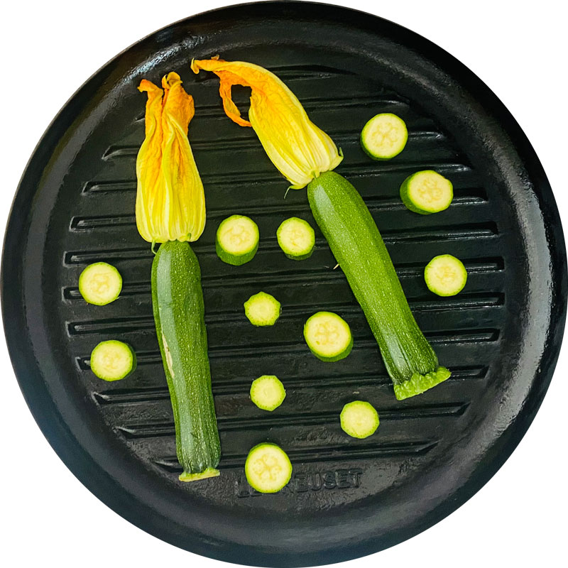 Halve one zucchini blossom (lengthwise), slice the second and grill for about 5 min.